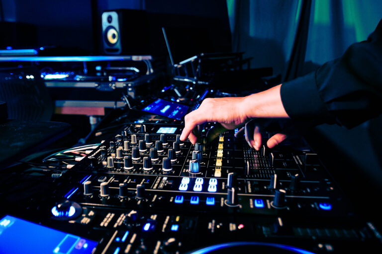 Beginner DJ student practicing on Pioneer CDJs during an in-person DJ class at Sound Collective NYC